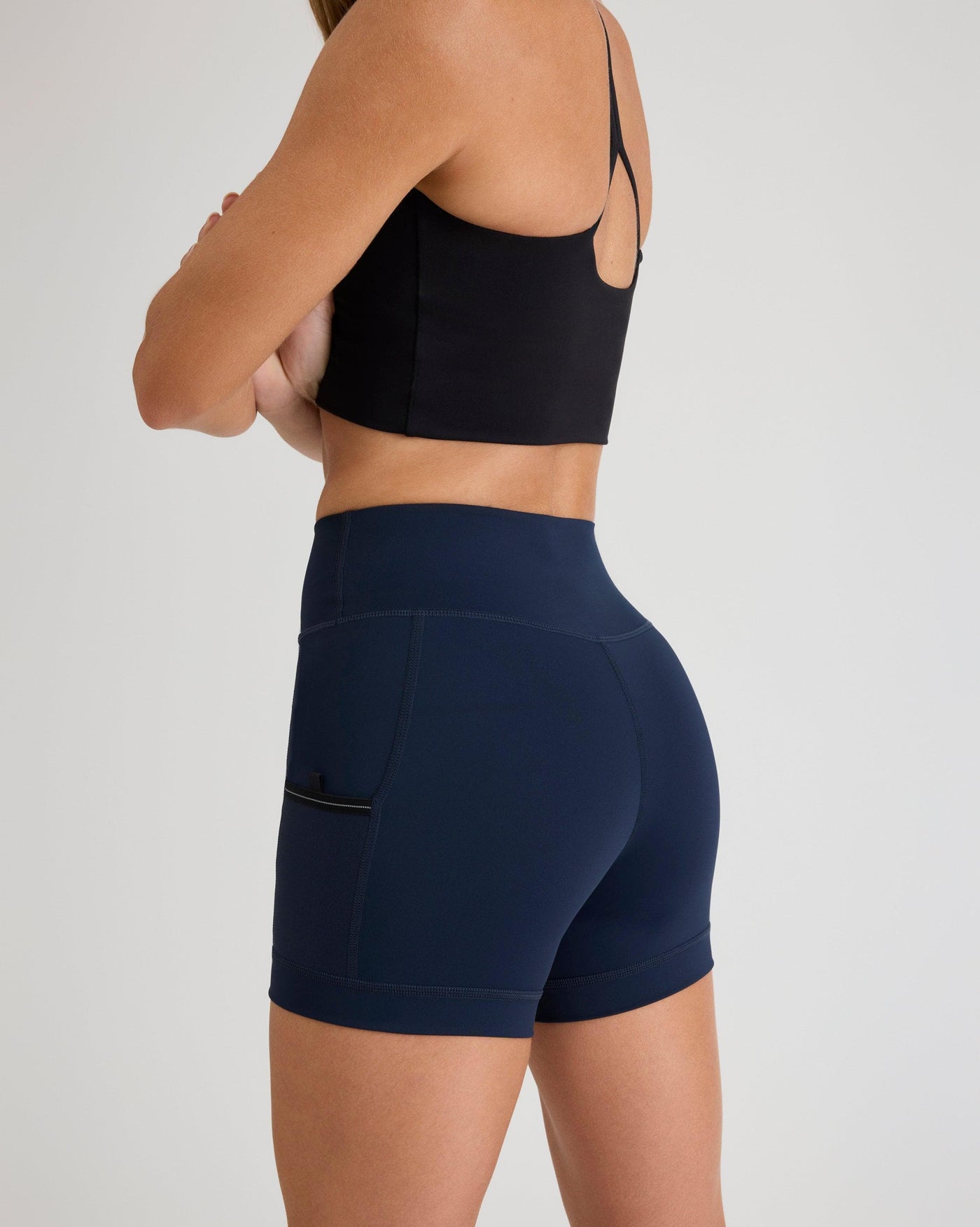 Niki (5’8”) is wearing a size small 4" inseam.