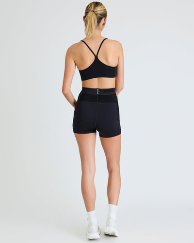 Olivia (5'7") is wearing size small 4" inseam