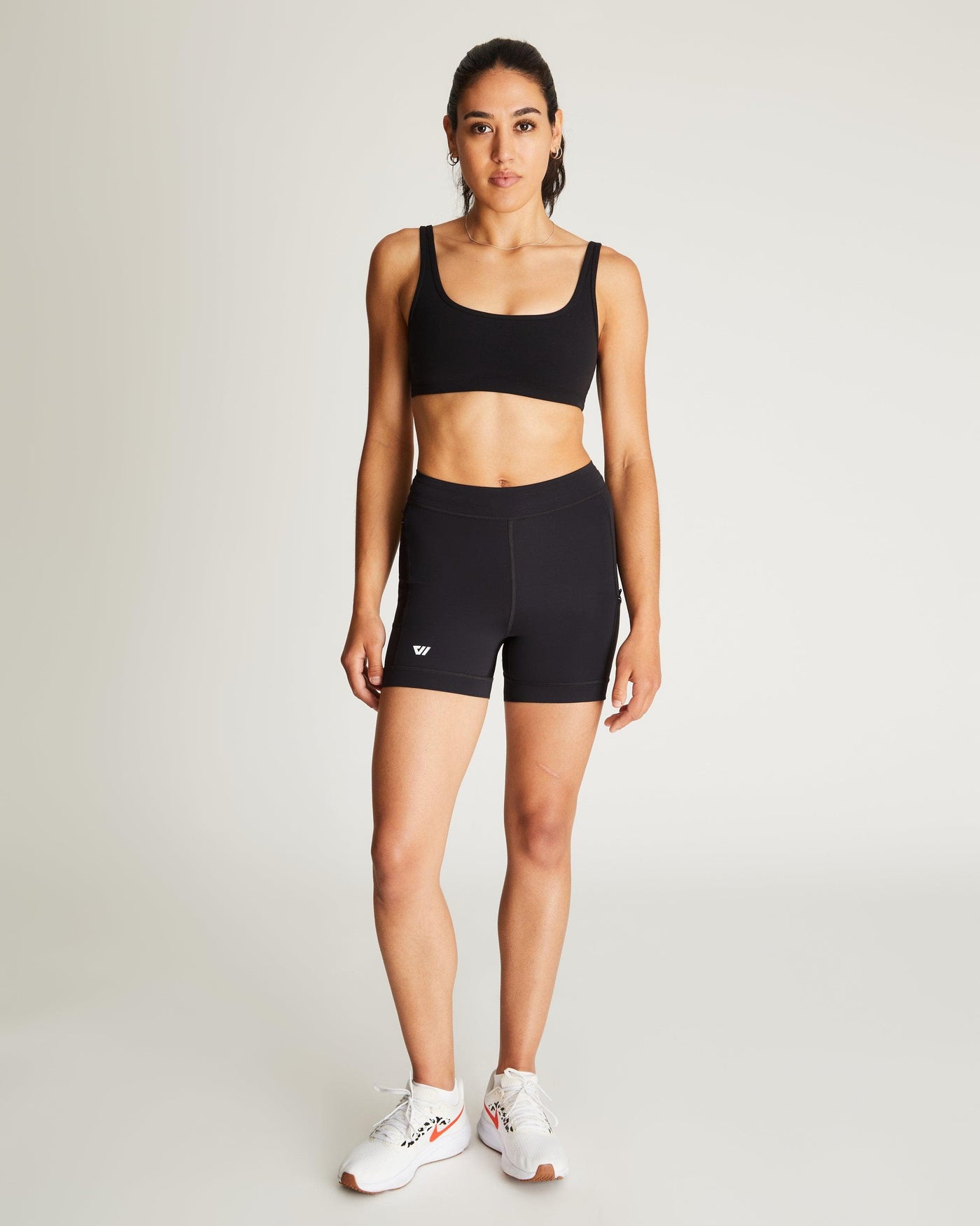 Isabella (5'7") is wearing size small 4" inseam