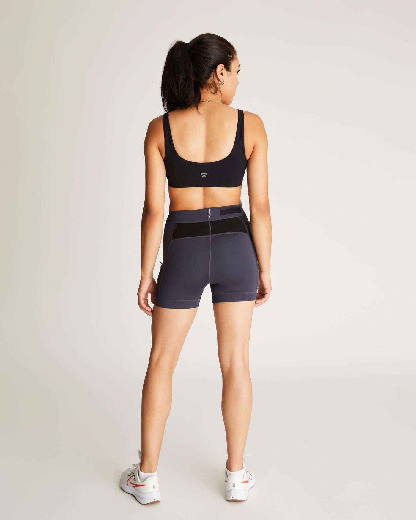 Isabella (5'7") is wearing size small 4" inseam