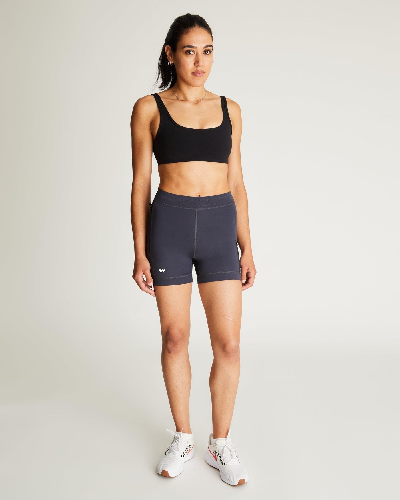 Isabella (5'7") is wearing size small 4" inseam