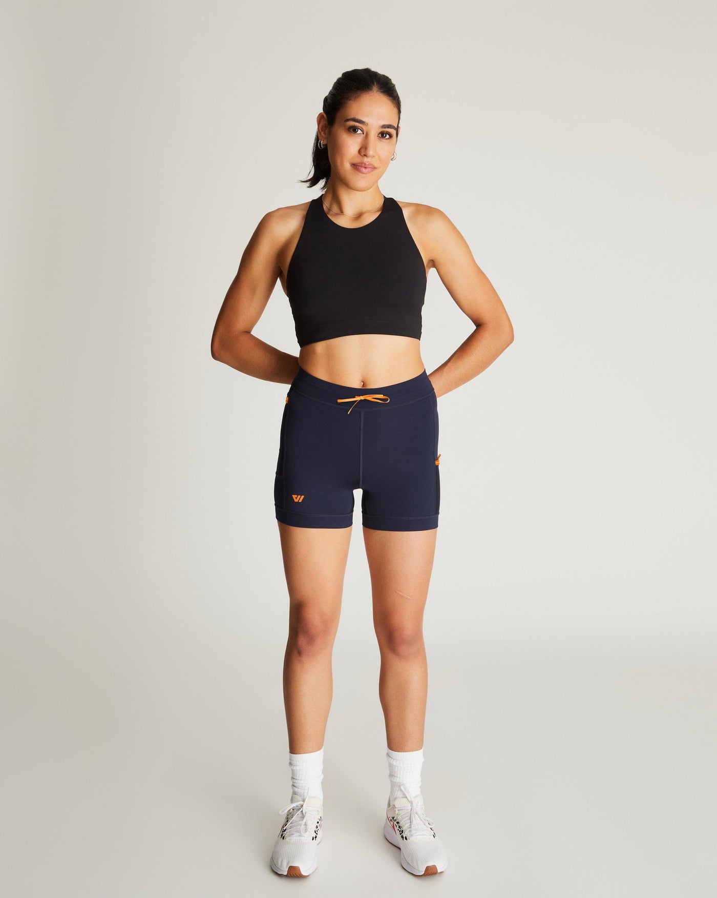 Isabella (5'7") is wearing size small 4" inseam