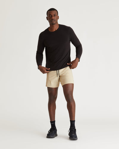 Mikael (6’3") is wearing size medium